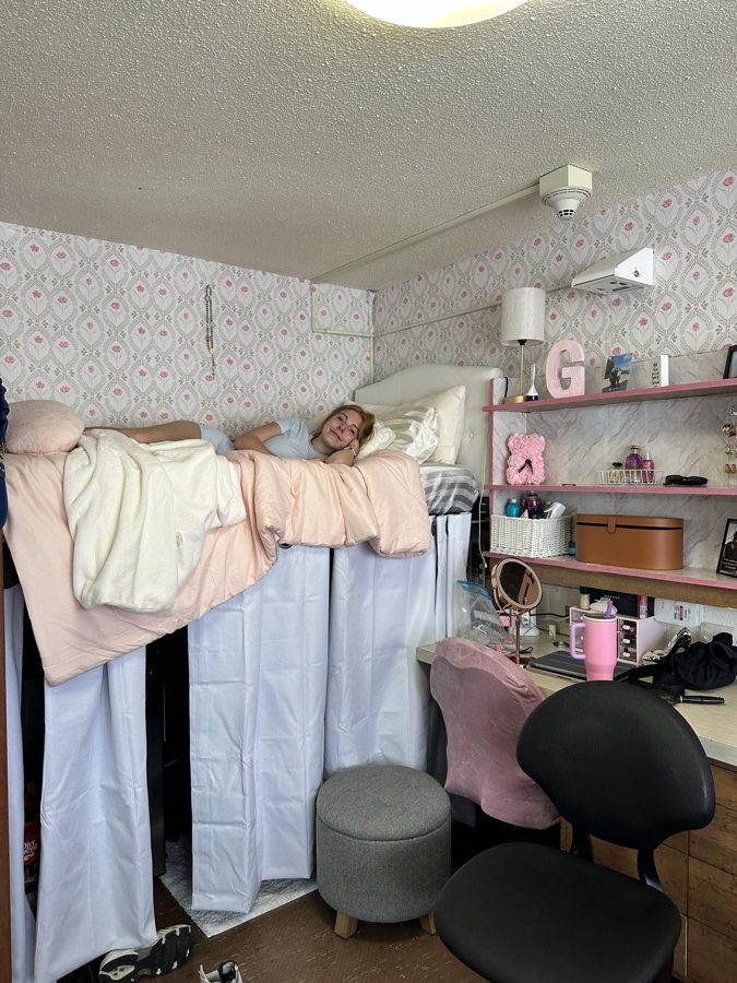 Her daughter settled into the lofted dorm bed